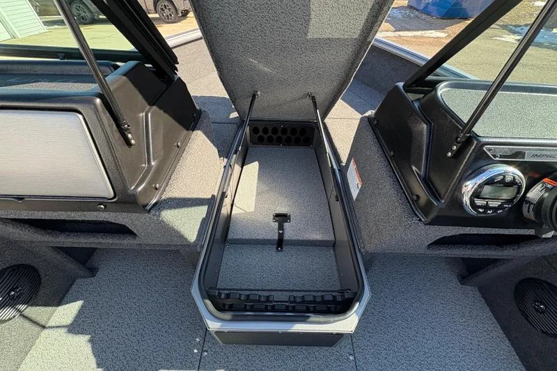 Slide: The Image of 2026 Lund 1875 Impact XS Sport boat interior with open storage compartment. - 17