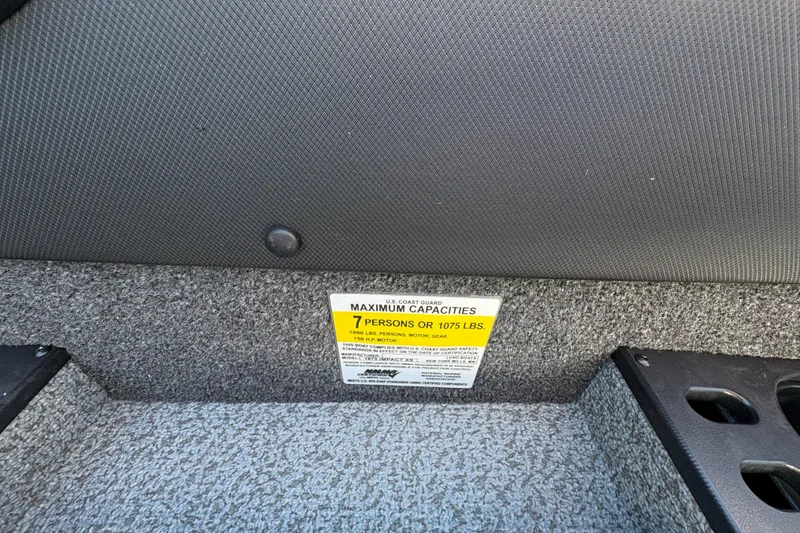 Slide: The Image of 2026 Lund 1875 Impact XS Sport boat capacity label, 7 persons or 1075 lbs. - 23