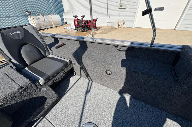Slide: The Image of Interior of 2026 Lund 1875 Impact XS Sport boat with seating and storage. - 26