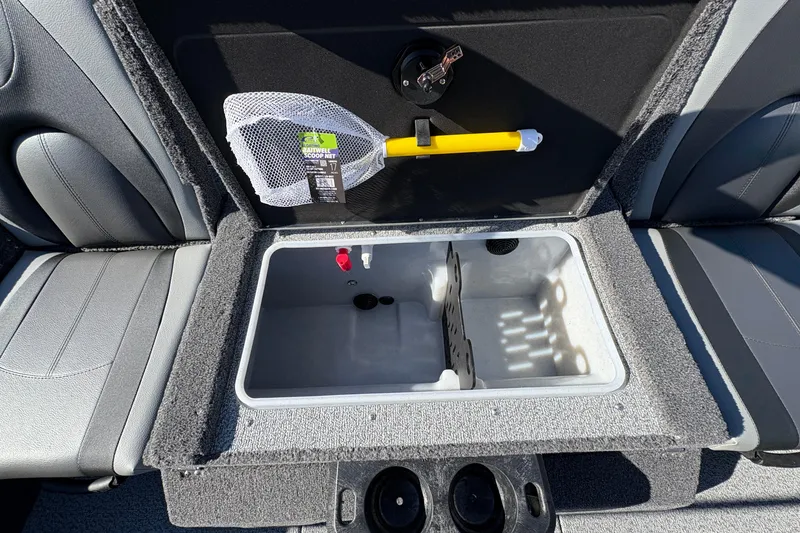 Slide: The Image of 2026 Lund 1875 Impact XS Sport boat interior with storage compartment and fishing net. - 29