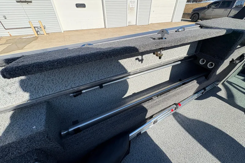 Slide: The Image of Interior storage compartment of 2026 Lund 1875 Impact XS Sport boat. - 34