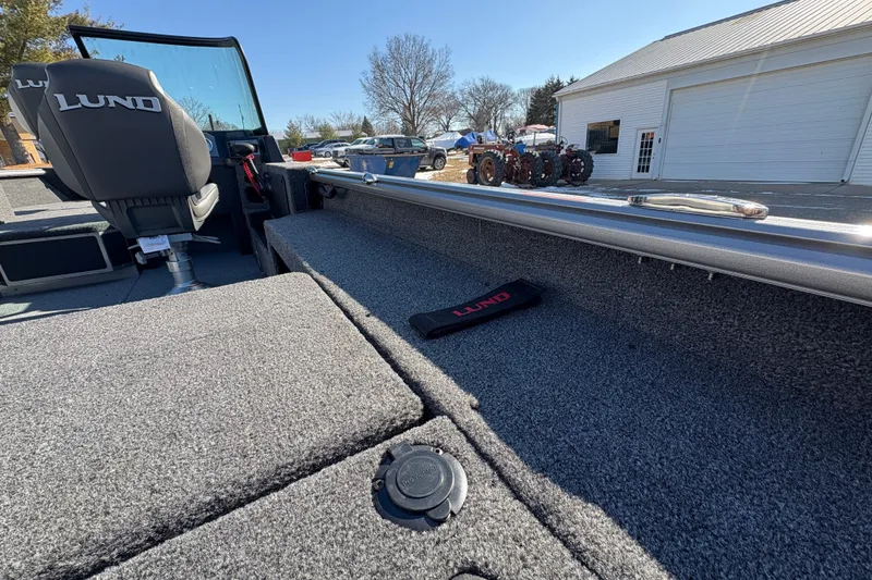 Slide: The Image of 2026 Lund 1875 Impact XS Sport boat interior with seating and storage compartments. - 37