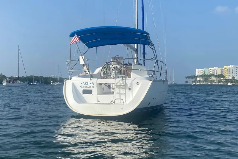 Slide: The Image of Beneteau Oceanis Clipper 323 sailboat, 2006 model, anchored in calm waters. - 13