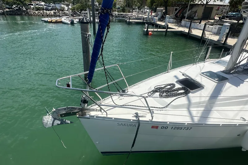 Slide: The Image of Beneteau Oceanis Clipper 323 sailboat docked in marina, 2006 model, named "Sakura". - 18