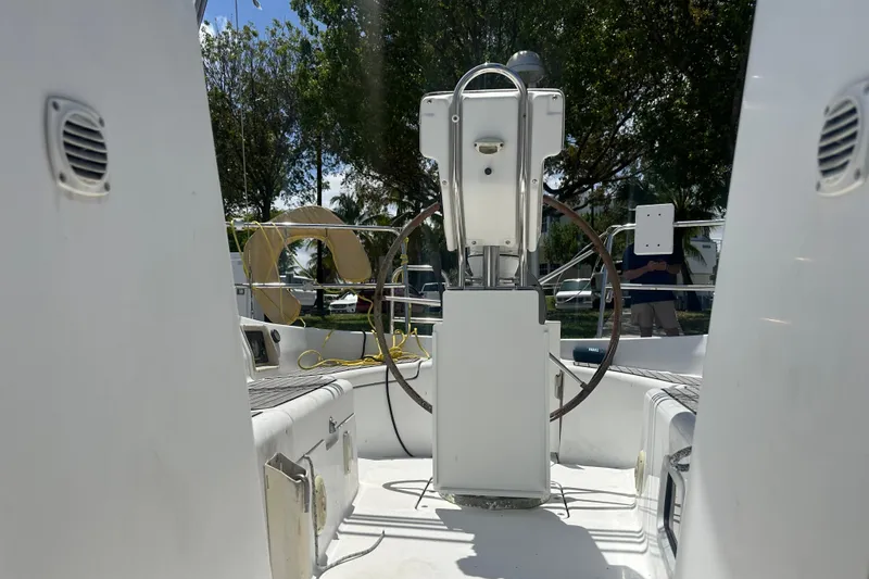 Slide: The Image of Cockpit view of 2006 Beneteau Oceanis Clipper 323 sailboat with steering wheel and outdoor setting. - 37