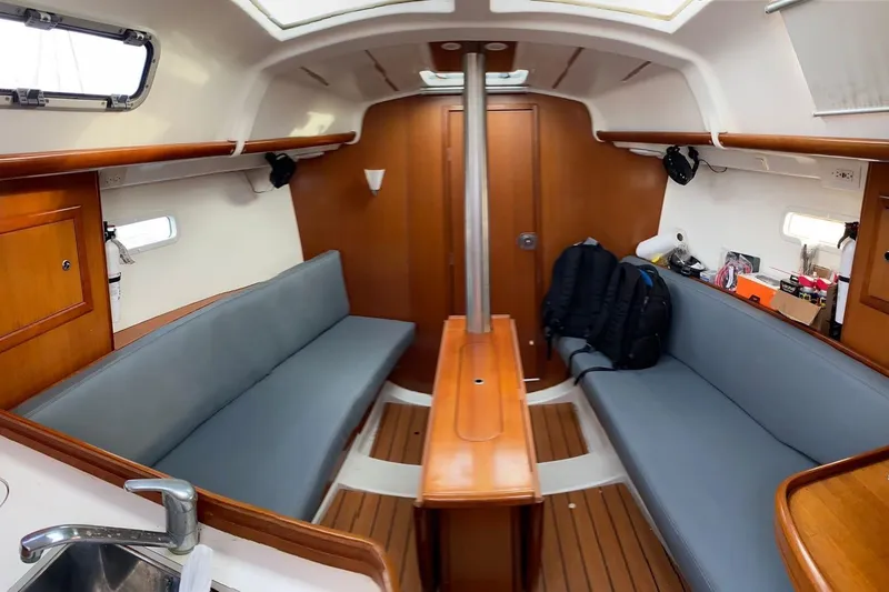 Slide: The Image of Interior of 2006 Beneteau Oceanis Clipper 323 sailboat with wooden finishes and seating. - 54