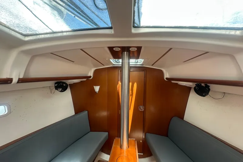 Slide: The Image of Interior of 2006 Beneteau Oceanis Clipper 323 sailboat with seating and skylight. - 57
