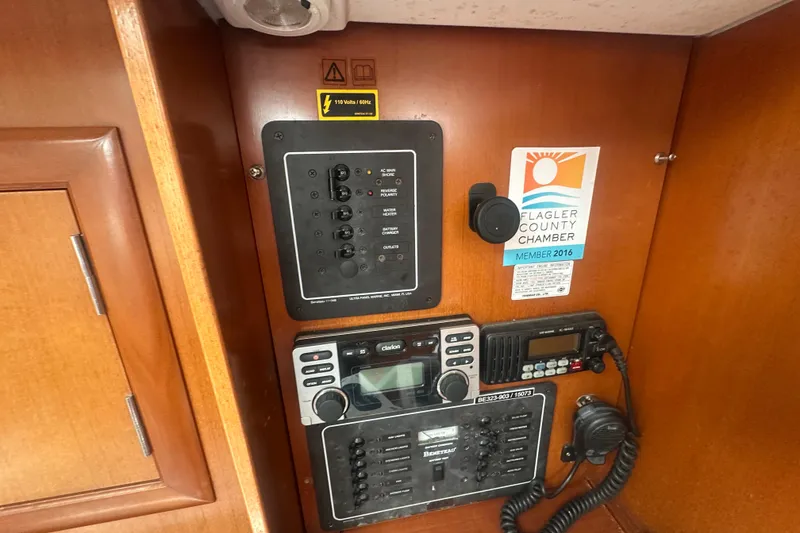 Slide: The Image of Electrical panel and radio equipment inside a 2006 Beneteau Oceanis Clipper 323 sailboat. - 64