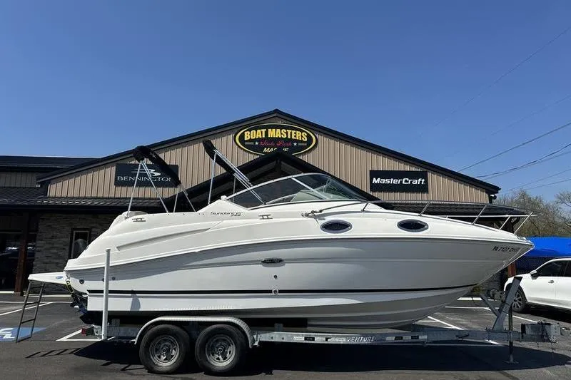 The Image of 2010 Sea Ray 240 Sundancer boat on trailer outside Boat Masters store. - 0