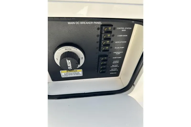 Slide: The Image of Main DC breaker panel on 2010 Sea Ray 240 Sundancer boat, featuring control switches. - 10