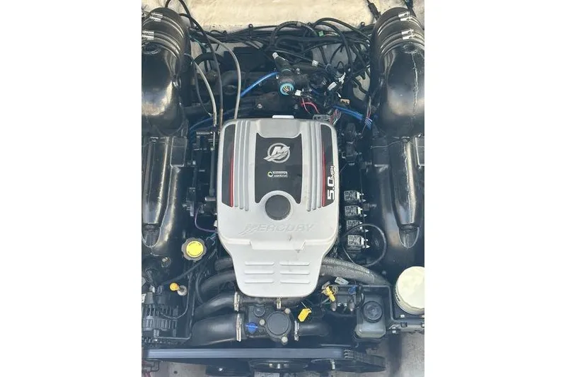 Slide: The Image of Engine of a 2010 Sea Ray 240 Sundancer boat, featuring MerCruiser 5.0 MPI. - 16