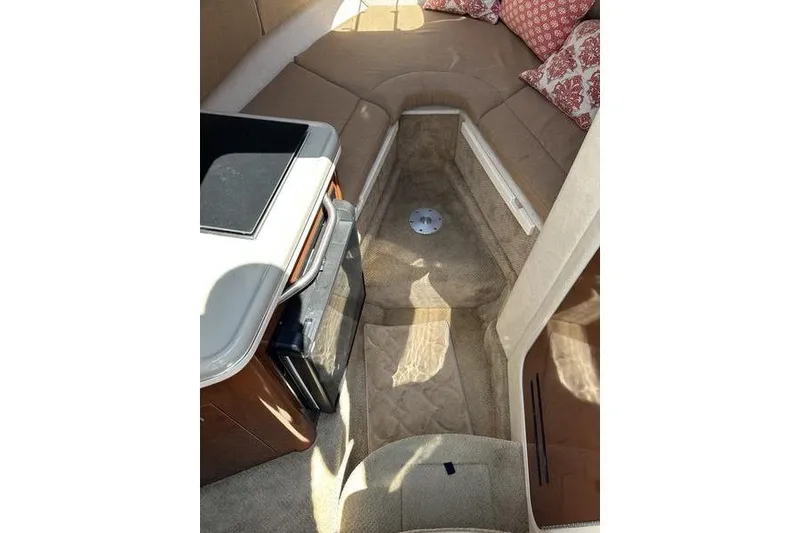 Slide: The Image of Interior of 2010 Sea Ray 240 Sundancer boat with seating and kitchenette. - 2