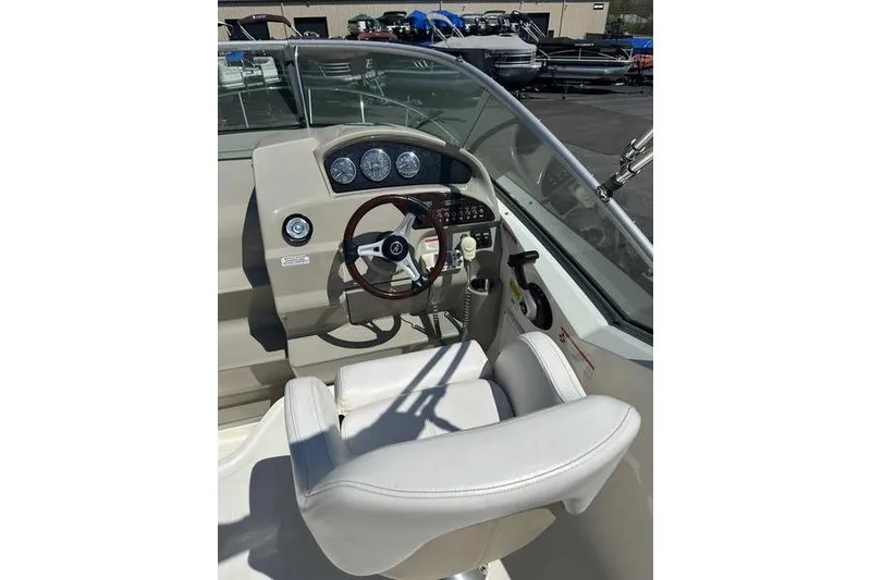 Slide: The Image of Helm of 2010 Sea Ray 240 Sundancer boat with steering wheel and gauges. - 21