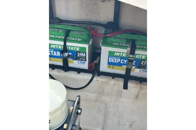 Slide: The Image of Interstate marine batteries in a 2010 Sea Ray 240 Sundancer boat compartment. - 26