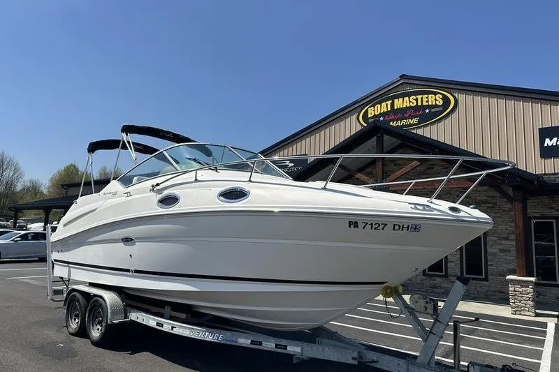 Slide: The Image of 2010 Sea Ray 240 Sundancer boat on trailer outside Boat Masters store. - 3