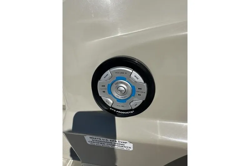 Slide: The Image of Control panel on a 2010 Sea Ray 240 Sundancer boat, featuring audio system buttons. - 7