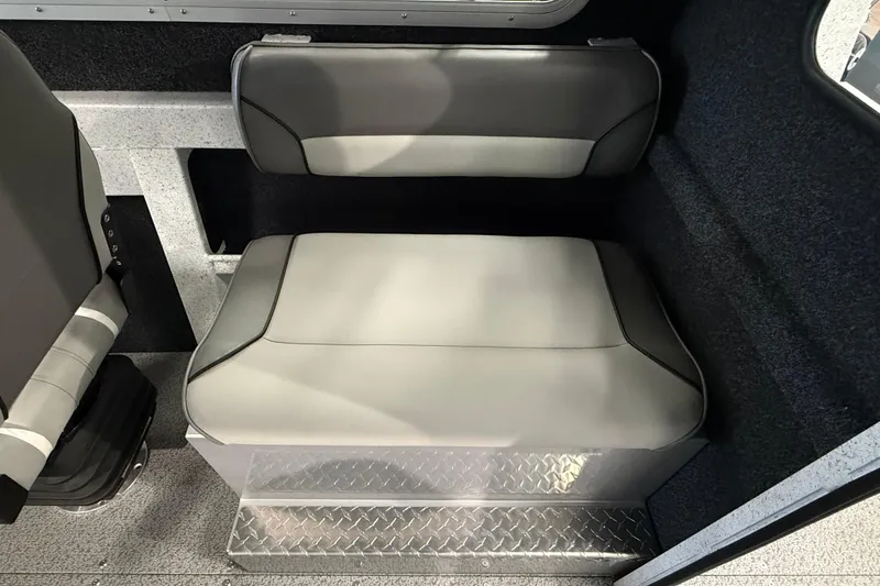 Slide: The Image of Interior seating of 2025 KingFisher Escape HT boat, featuring gray cushioned seats. - 15