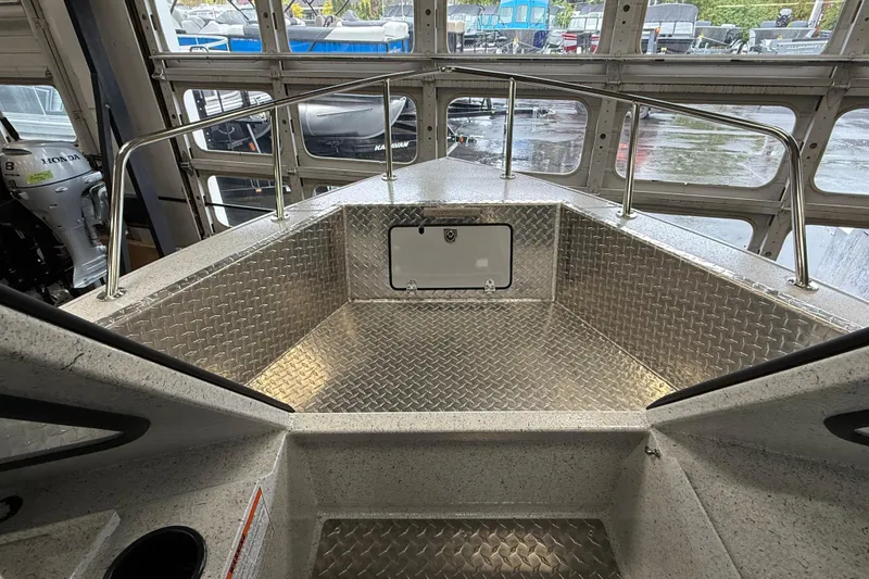Slide: The Image of Interior view of 2025 KingFisher Escape HT boat with diamond plate flooring. - 18
