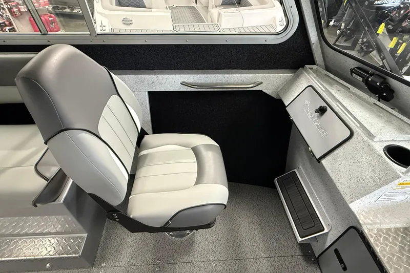 Slide: The Image of Interior of 2025 KingFisher Escape HT boat with gray seating and control panel. - 20