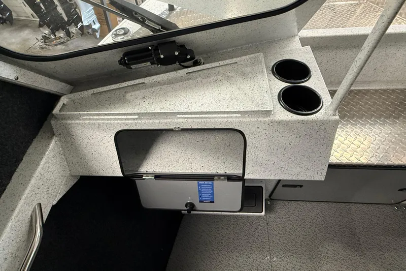 Slide: The Image of Interior of 2025 KingFisher Escape HT boat with storage and cup holders. - 23