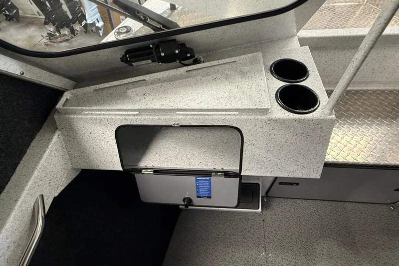 Slide: The Image of Interior of 2025 KingFisher Escape HT boat with storage and cup holders. - 24