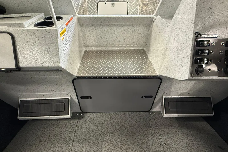 Slide: The Image of Interior of 2025 KingFisher Escape HT boat with storage compartments and control panel. - 25