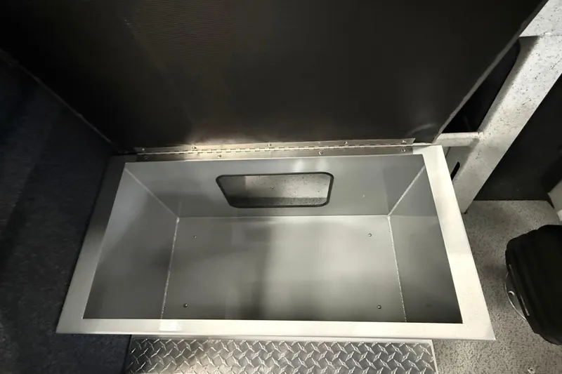 Slide: The Image of Storage compartment in 2025 KingFisher Escape HT boat, featuring durable metal construction. - 27