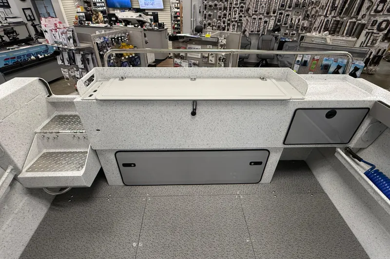 Slide: The Image of Interior view of a 2025 KingFisher Escape HT boat, showcasing storage compartments and seating. - 6