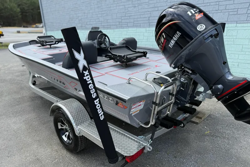 Slide: The Image of 2026 Xpress H18C Crappie boat with Yamaha 115 engine on trailer. - 7