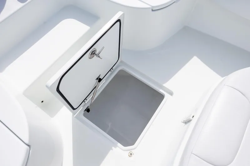 Slide: The Image of Open storage compartment on 2024 Contender 23 Bay boat, showcasing interior space. - 32