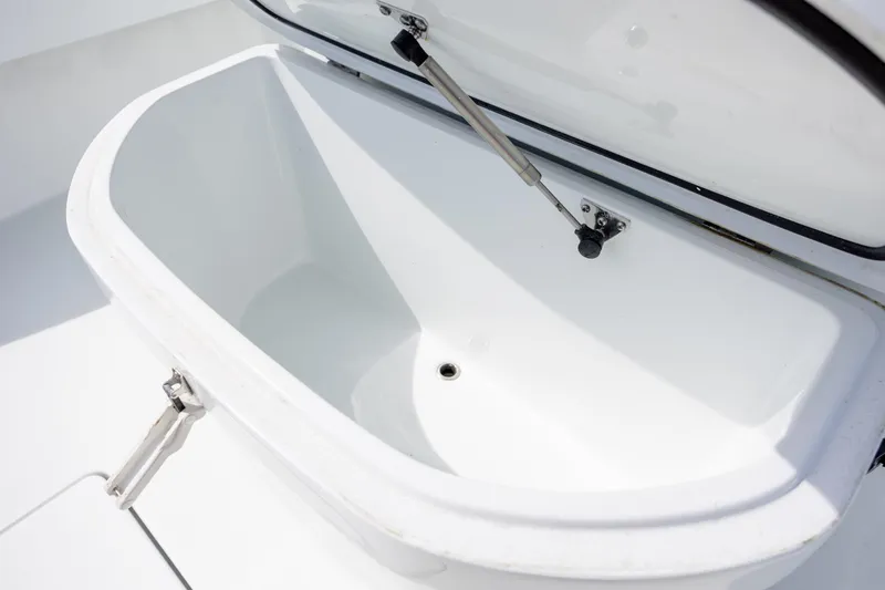 Slide: The Image of Open storage compartment on 2024 Contender 23 Bay boat, showcasing interior design. - 34