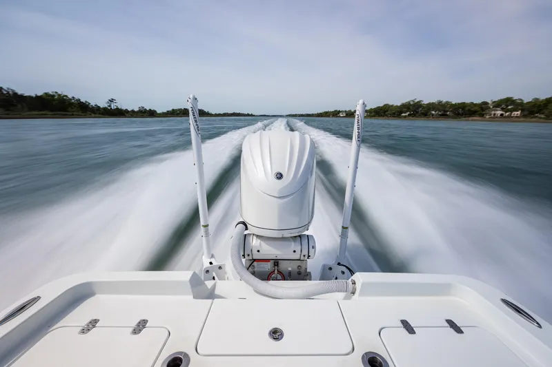 Slide: The Image of 2024 Contender 23 Bay boat speeding on water, showcasing powerful engine and sleek design. - 46