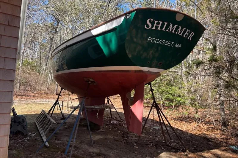 Slide: The Image of Sailboats anchored on calm water, featuring a 1998 Peter Scott Chuck Paine 30. - 3