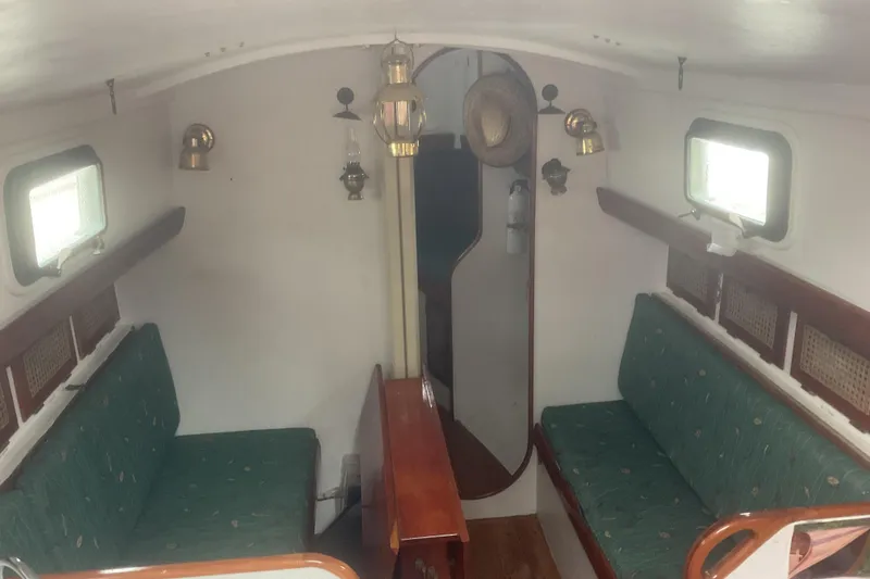 Slide: The Image of Sailboat "Peter Scott Chuck Paine 30" 1998 on calm water at sunset. - 5