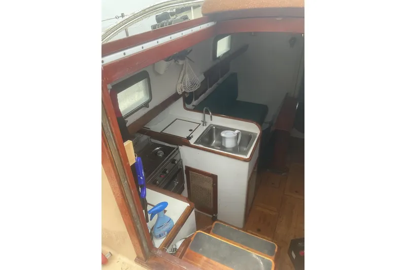 Slide: The Image of Sailboat view from Peter Scott Chuck Paine 30, 1998, on calm waters. - 6