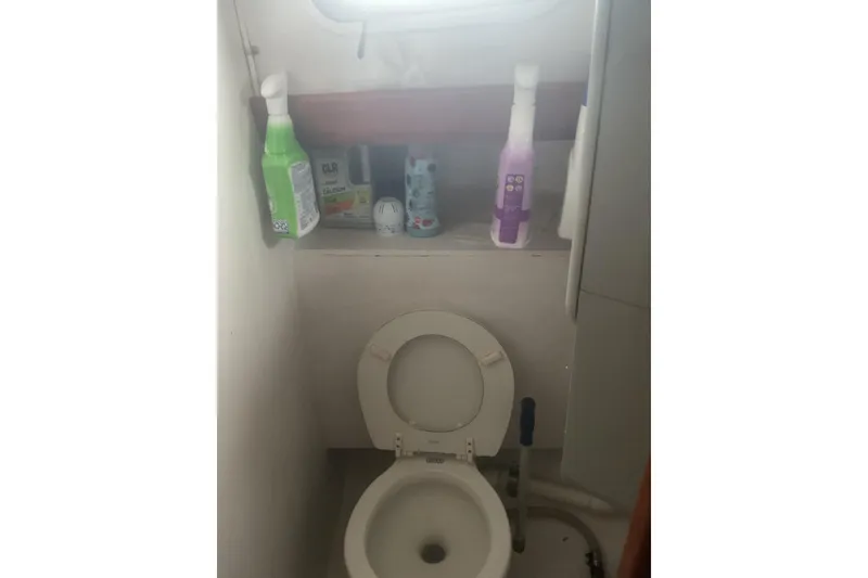 Slide: The Image of Interior of 1998 Peter Scott Chuck Paine 30 sailboat, featuring compact kitchen area. - 8