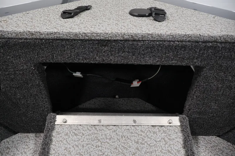 Slide: The Image of Interior storage compartment of 2026 Crestliner 2050 Authority boat, featuring carpeted finish. - 22