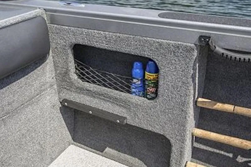 Slide: The Image of Interior storage compartment of 2026 Crestliner 2050 Authority boat with netted pocket. - 10