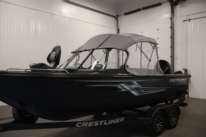 Slide: The Image of 2026 Crestliner 2050 Authority boat with canopy in indoor showroom. - 57