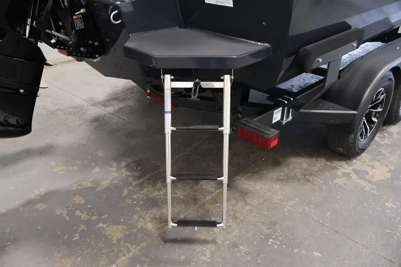 Slide: The Image of Rear view of 2026 Crestliner 2050 Authority boat with ladder and trailer. - 47