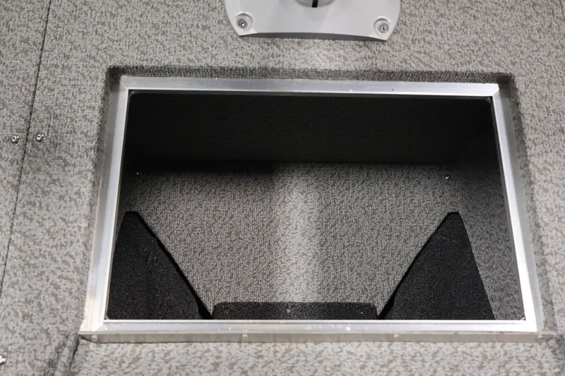 Slide: The Image of Storage compartment in 2026 Crestliner 2050 Authority boat, featuring a textured interior. - 25