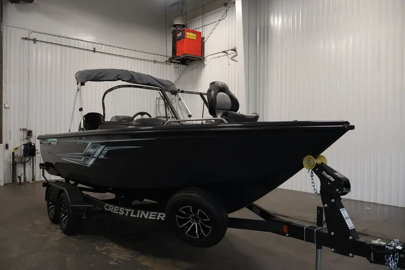 Slide: The Image of 2026 Crestliner 2050 Authority boat on trailer in indoor storage facility. - 13