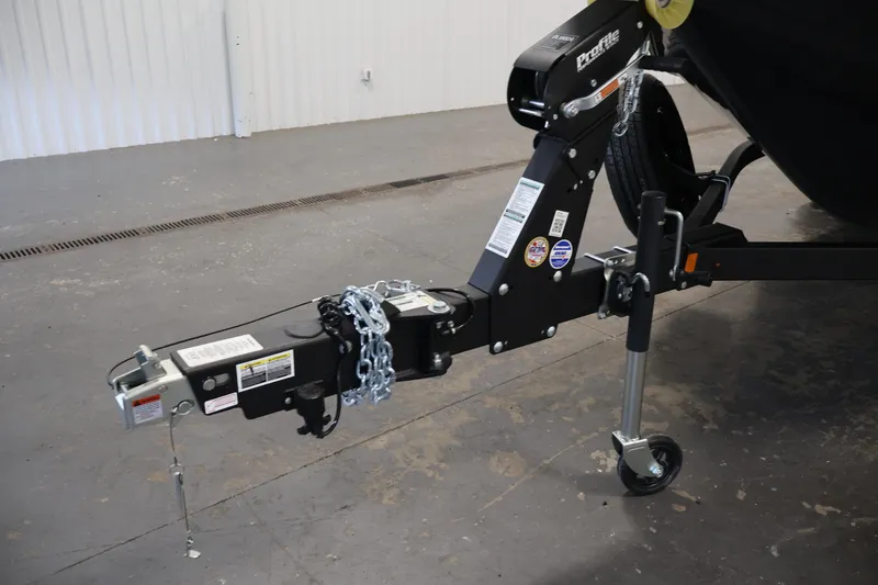 Slide: The Image of Trailer hitch of 2026 Crestliner 2050 Authority boat, featuring secure chains and sturdy construction. - 53