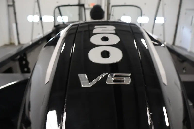 Slide: The Image of Close-up of 2026 Crestliner 2050 Authority V6 engine cover indoors. - 49