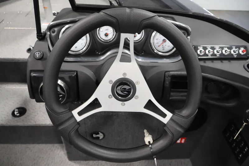 Slide: The Image of Steering wheel and dashboard of 2026 Crestliner 2050 Authority boat, featuring gauges and controls. - 32