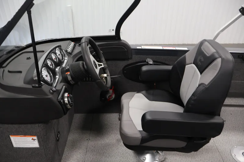 Slide: The Image of Interior of 2026 Crestliner 2050 Authority boat with steering wheel and captain's chair. - 30