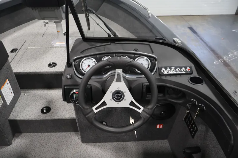 Slide: The Image of 2026 Crestliner 2050 Authority boat dashboard with steering wheel and instrument panel. - 31