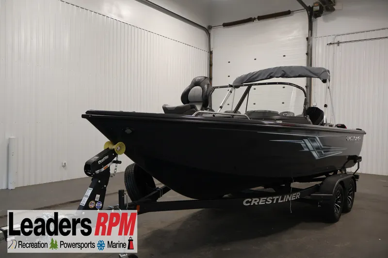 The Image of 2026 Crestliner 2050 Authority boat in showroom, displayed on trailer. - 11
