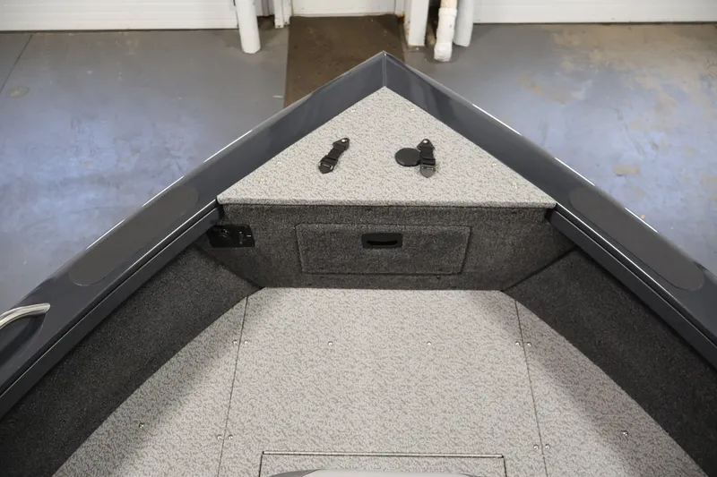 Slide: The Image of 2026 Crestliner 2050 Authority boat interior, featuring a spacious, carpeted bow area with storage. - 21