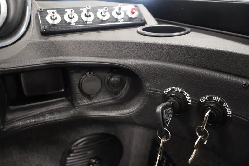 Slide: The Image of Control panel of 2026 Crestliner 2050 Authority boat with ignition keys and switches. - 36